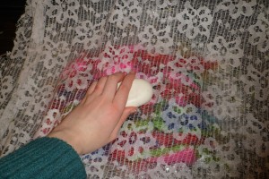 massaging the soap and water into the wool.